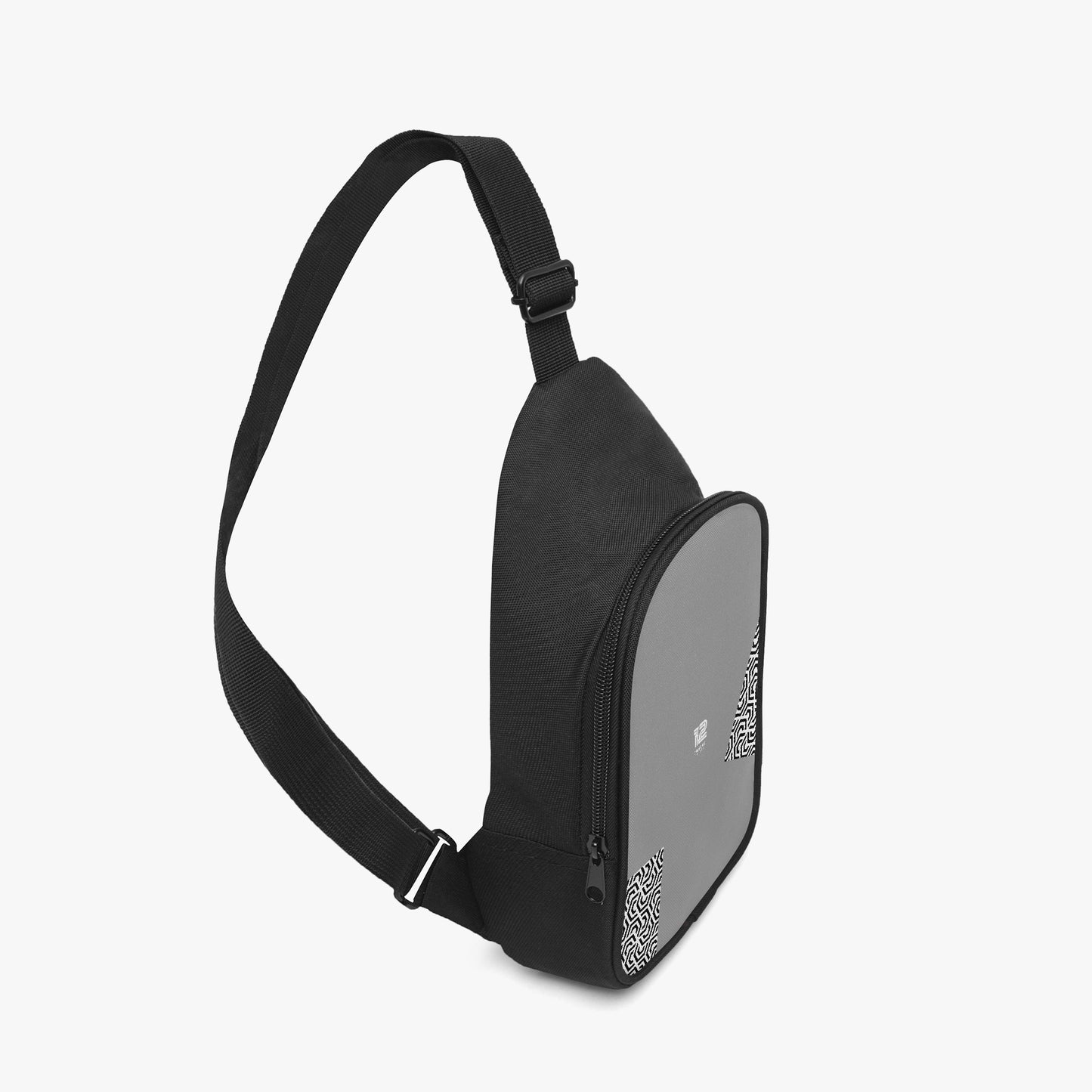 Black sling bag with a reflective surface on a light gray background